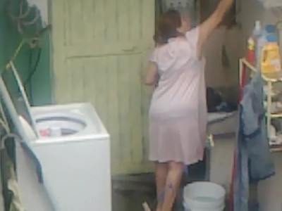 Laundry Room Voyeur - Voyeur shot of a curvaceous mom in the laundry room