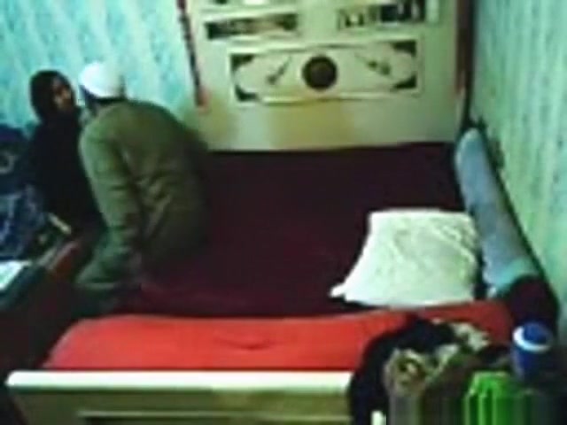 Voyeur tapes an arab hijab girl having missionary sex with a guy on the image